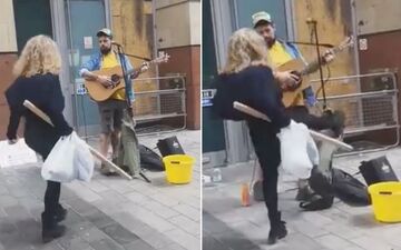 حمله ناگهانی زن عصبانی به نوازنده خیابانی!