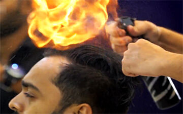 اصلاح موی سر با شعله‌های آتش! + فیلم